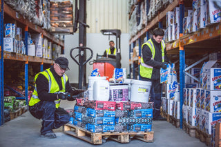 Trimline warehouse staff preparing a pallet of trade orders